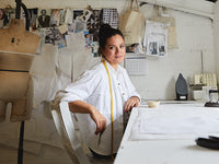 portrait of woman working as a pattern cutter